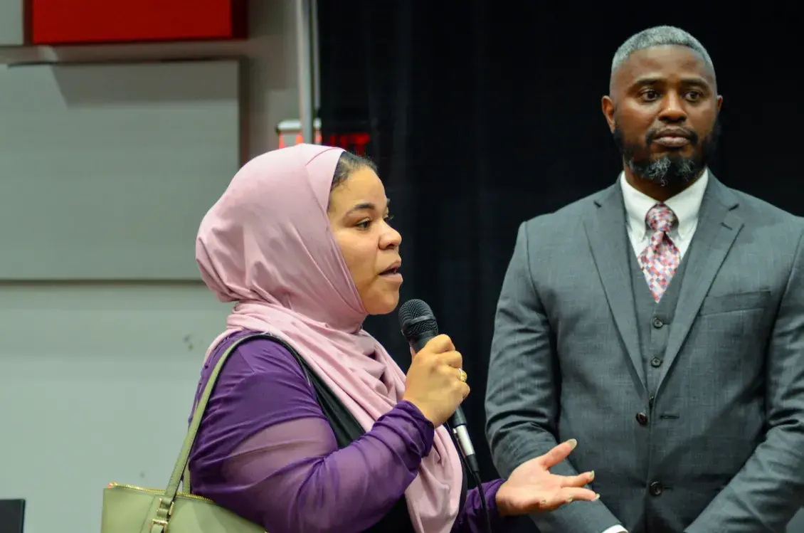 Woman in hijab speaking in microphone