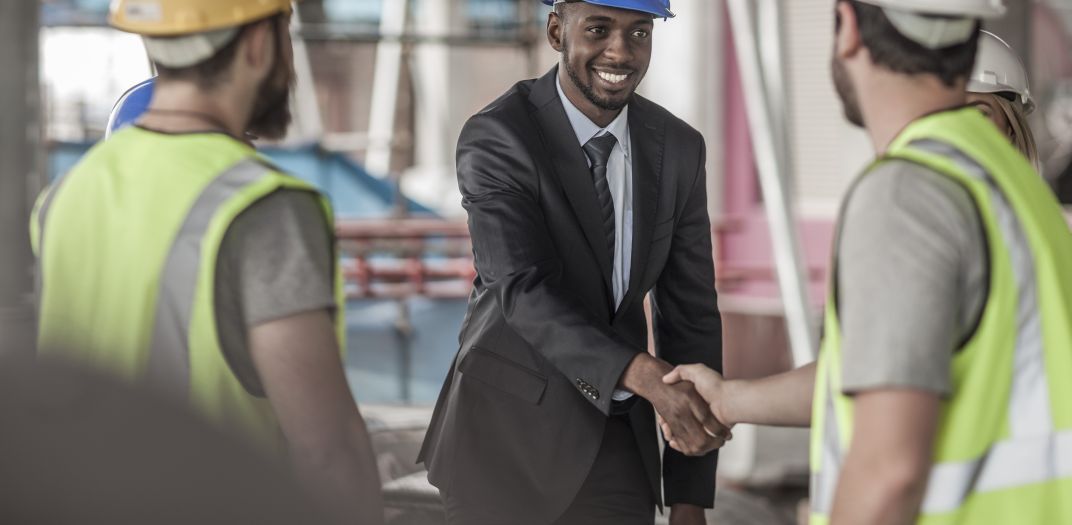 Shaking hands at construction sit