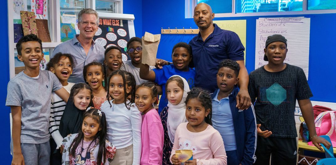 Shaun Donovan, president and CEO of Enterprise, meets with an afterschool group