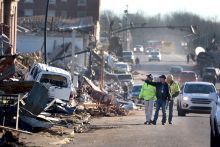 Workers survey wreckage from tornadoes