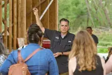 Man talking with group of people