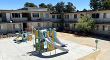 Photo of playground and apartments