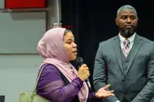Woman in hijab speaking in microphone