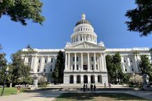 Photo of the California Capitol -- a white building with columns and dome