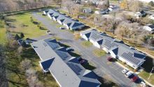 Housing with solar panels on roofs