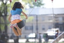 Girl in a swing at playground