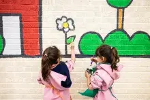 Children painting a mural