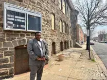 Pastor Rod Hudson, standing outside the Ames Memorial United Methodist Church in West Baltimore