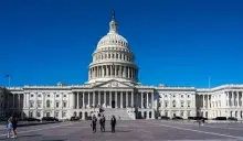 U.S. Capitol with women walking
