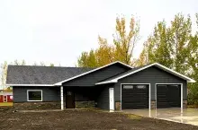 Grayish single-story, family home under construction