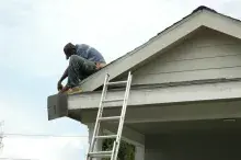 Man repairing roof