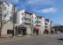 Streetview of Archway Communities Downing Square a white apartment building in Denver, Colorado