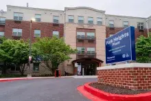 Exterior of red brick and tan building, Park Heights Place, senior housing in Baltimore