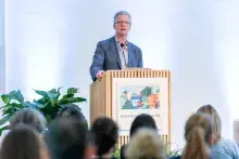 Shaun Donovan, CEO at Enterprise, speaks to an audience from a podium