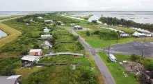 Aerial shot of a rural community showing homes and buildings destroyed