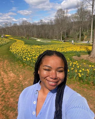 Woman standing in flower field