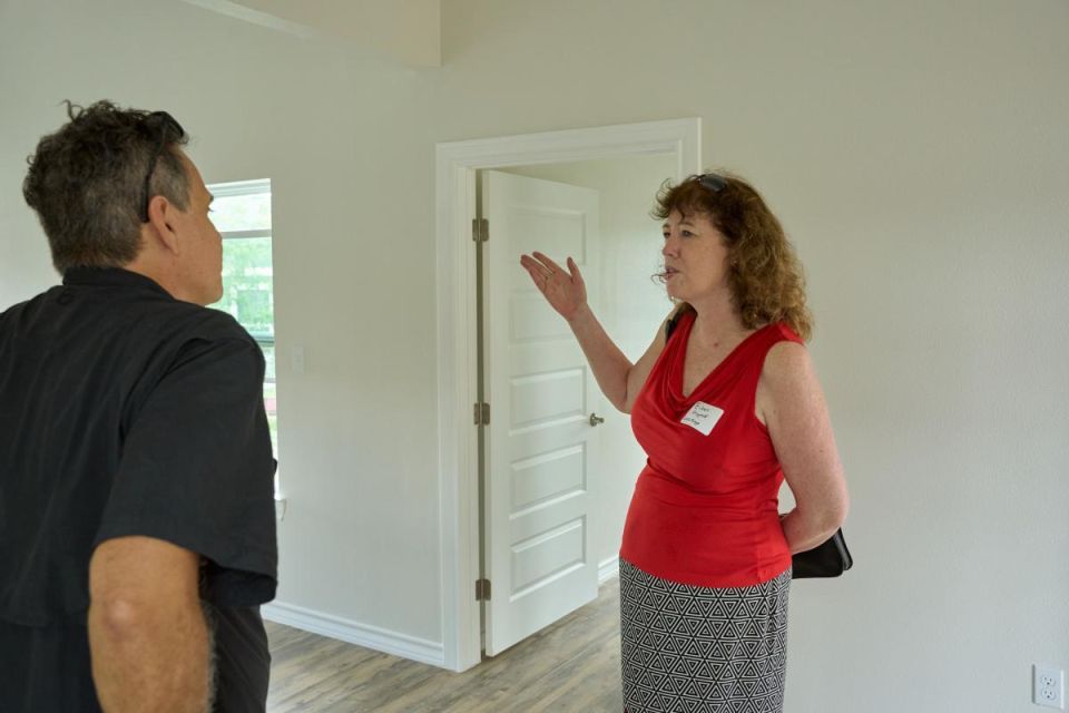 Nick Mitchell-Bennett speaks with Wells Fargo's Head of Housing Affordability Philanthropy Eileen Fitzgerald in a prototype of a MiCASiTA modular home.