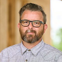 Headshot of Benje Feehan, Executive Director, buildingcommunityWORKSHOP