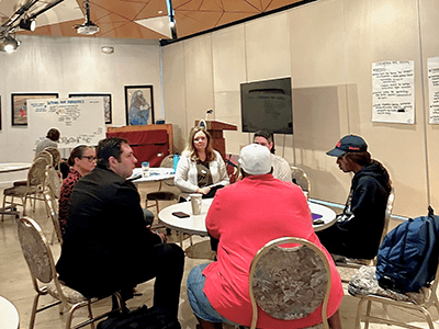 Group of people sitting at a roundtable