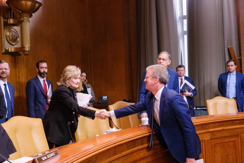 Shaun Donovan shaking hands with Senator Cindy Hyde-Smith 