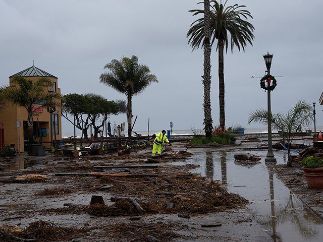 A person cleaning up from a storm