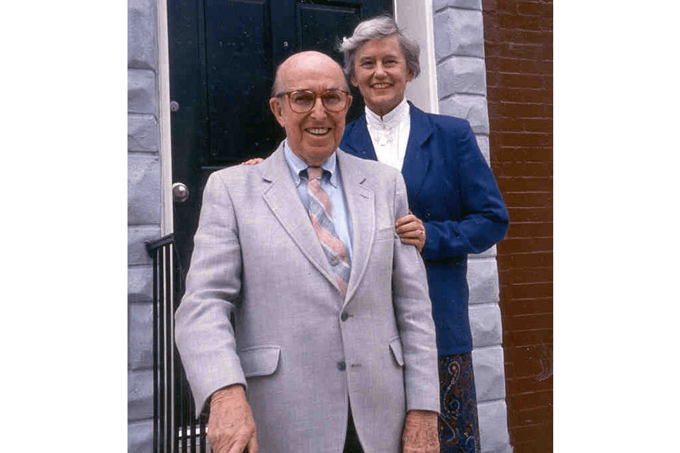 Jim and Patty Rouse at the steps of a doorway