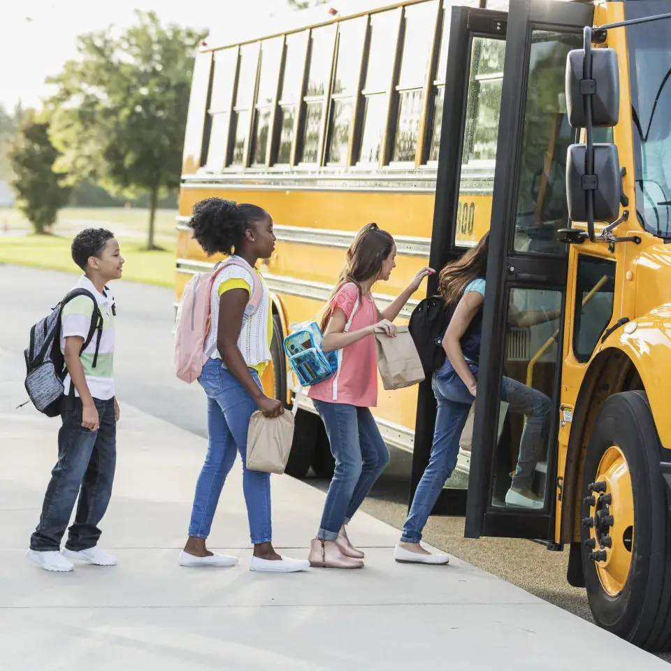 Students boarding a school bus
