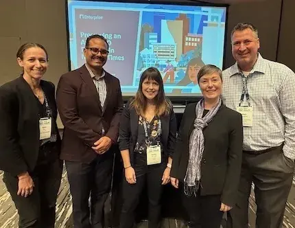 People in business attire smiling