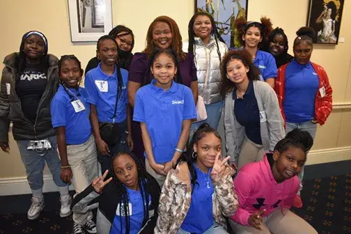 A group of young girls and an Enterprise Women's Network mentor