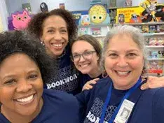 Four mentors of the Enterprise Women's Network in a classroom
