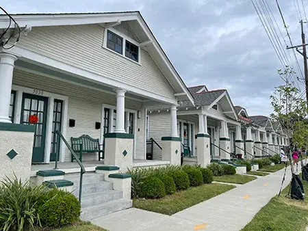 A street lined with white homes