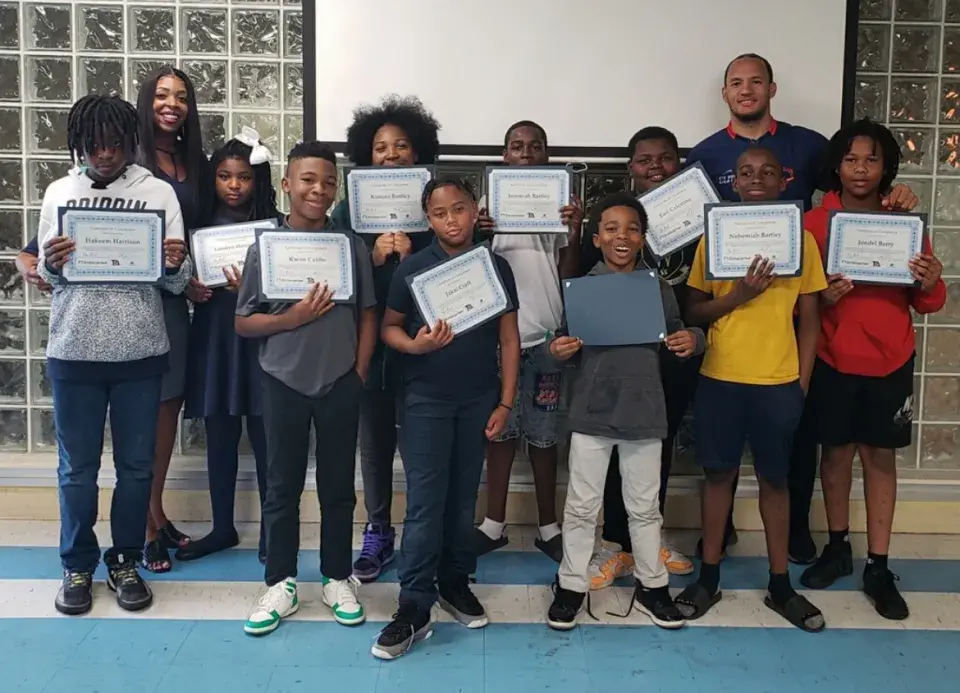 Ryan Brock with kids at Sojourner Truth Center