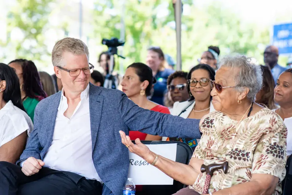 Enterprise CEO Shaun Donovan celebrates groundbreaking at Faubourg Lafitte in New Orleans with long-time resident and community advocate Emelda Paul.