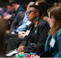 People sitting at a conference session
