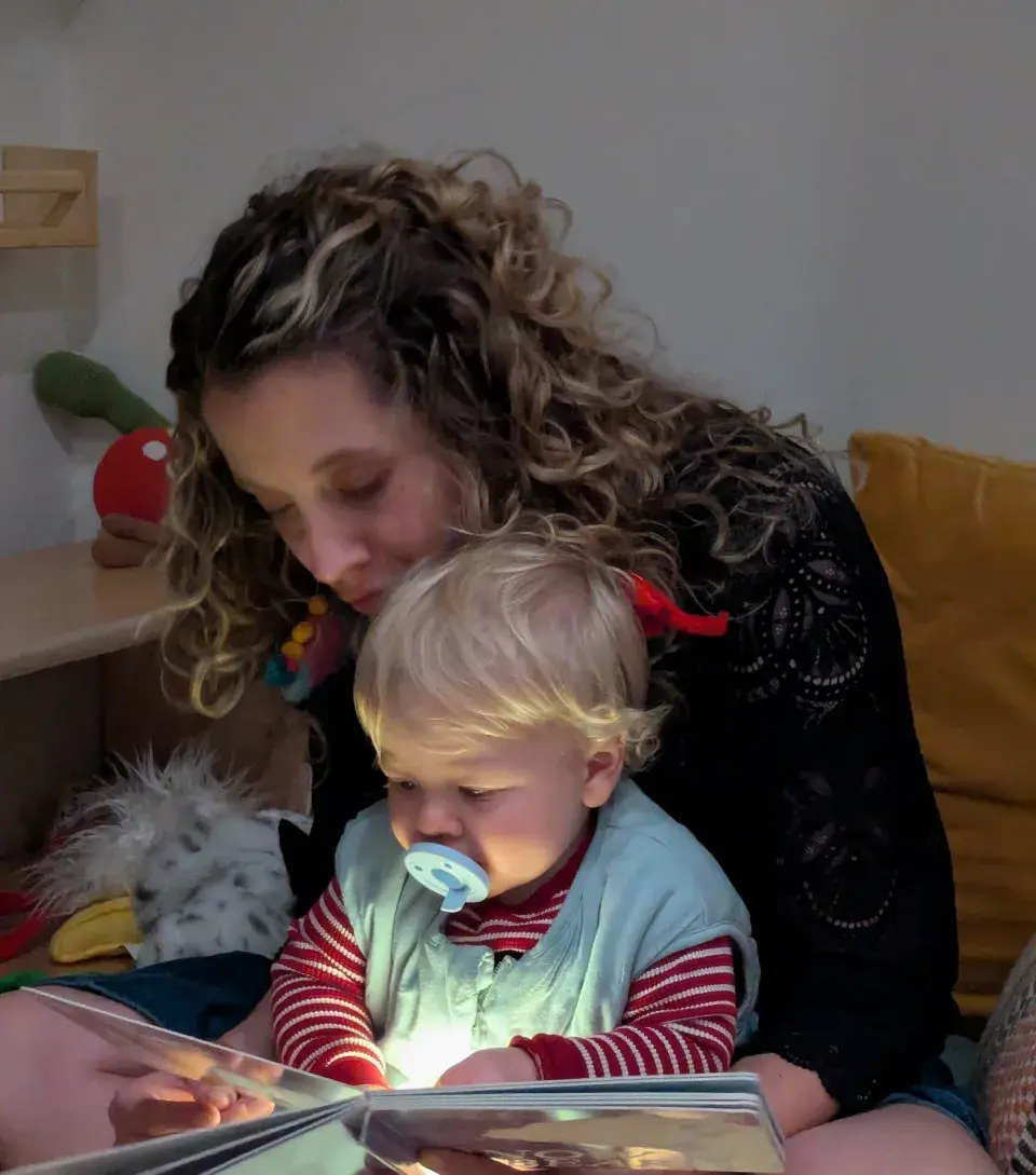 Claire Parisa reading to her son