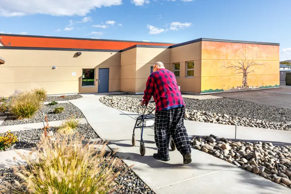 Man walking at Chuck Austin Place