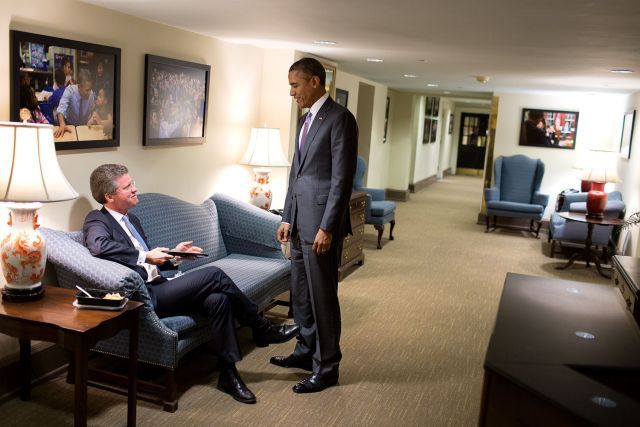 Shaun Donovan, Incoming CEO and President, sitting and speaking to President Obama who is standing