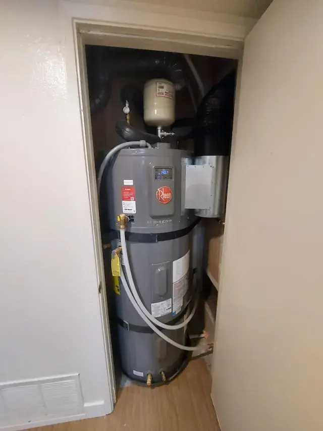 Electric water heater in a utility closet