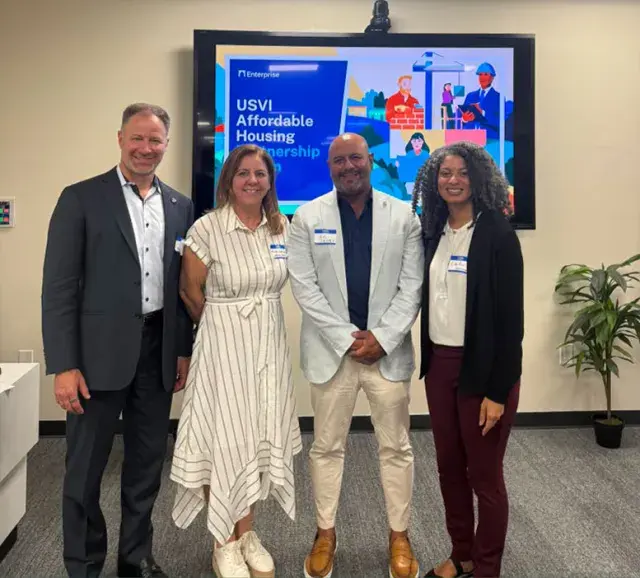 USVI Affordable Housing Workshop panelists stand in front of a projection