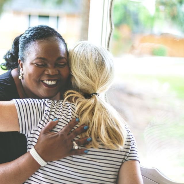 two ladies hugging