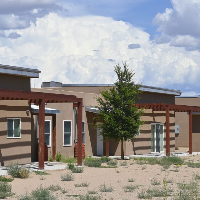 Wa-Di Housing development in Santo Domingo, New Mexico against a blue cloudy sky