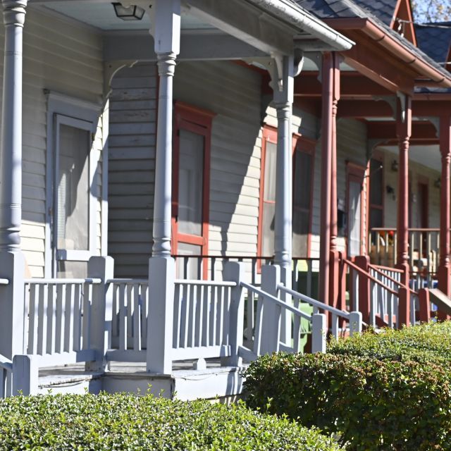 Front porches of a row of homes
