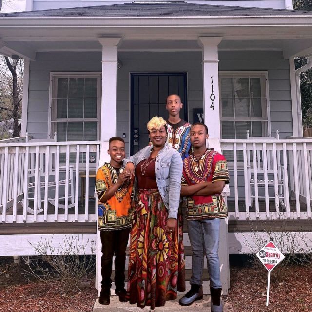 The Robinson Family in front of their home