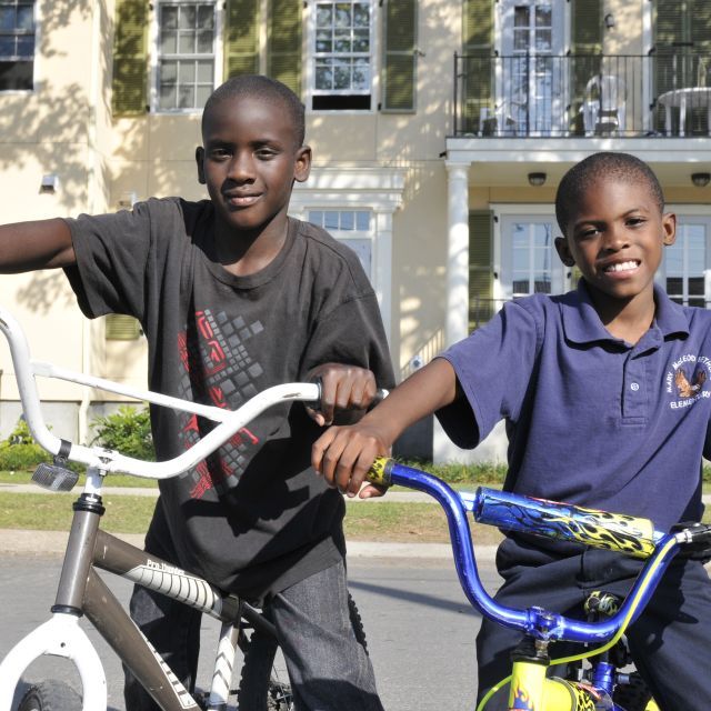 Two boys riding bikes