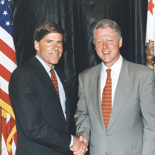 Bart Harvey and Bill Clinton shaking hands