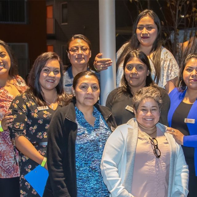 A group of woman posing for a picture