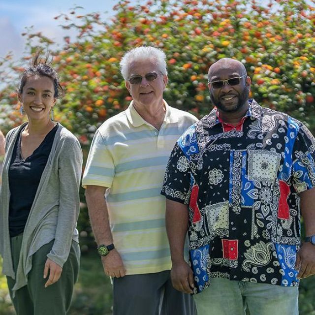 A group of five people standing outside