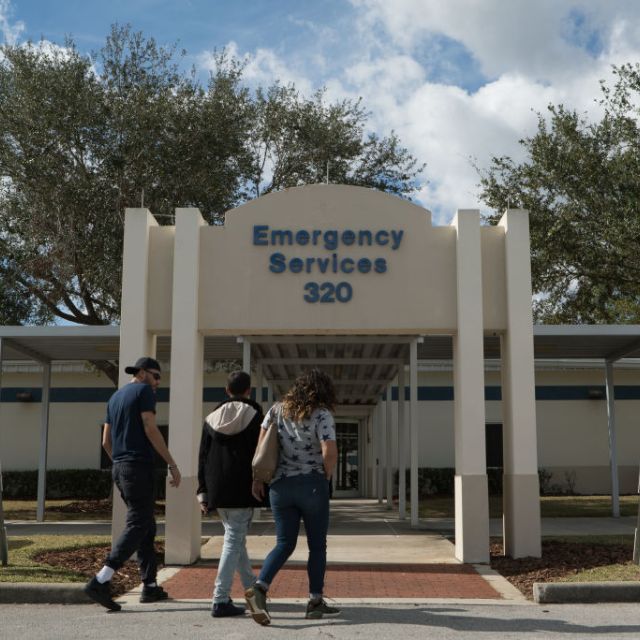 People entering emergency services location after hurricane