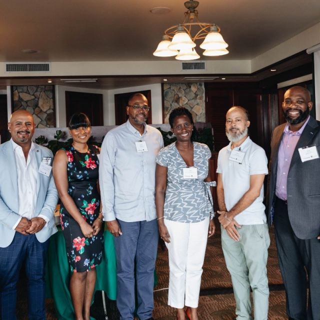 Enterprise team and the USVI Housing Ecosystem Development grantees stand together