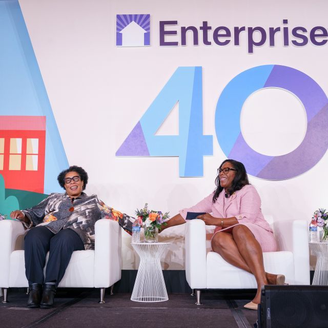 HUD Secretary Fudge and Jacqueline Waggoner onstage at Enterprise's 40th anniversary conference